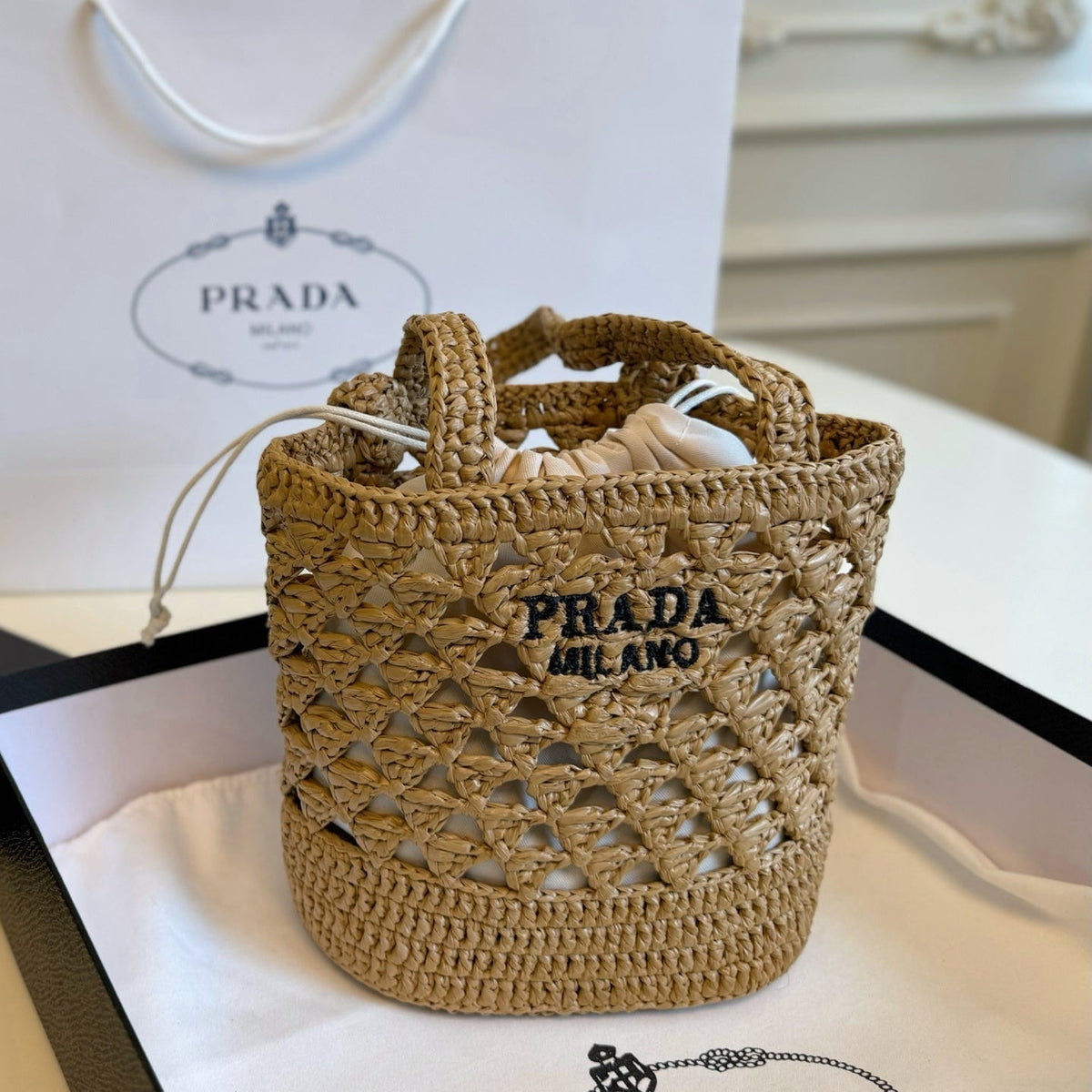CROCHET BUCKET BAG 32 IN BROWN WOVEN RAFFIA EMBROIDED LOGO