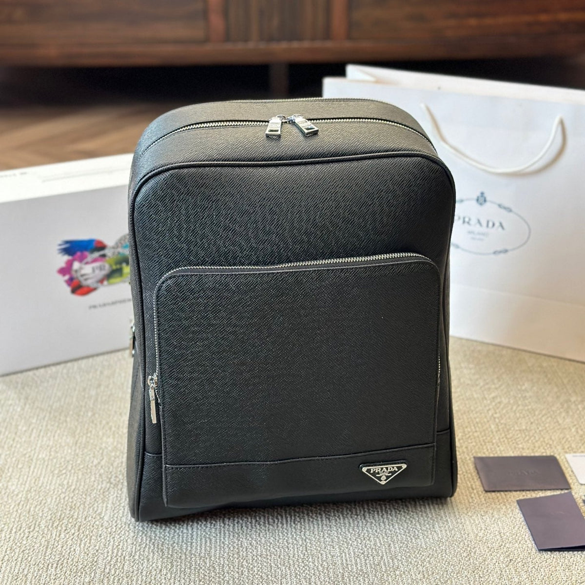 FRONT ZIP POCKET BACKPACK 38 IN BLACK GRAINED CALFSKIN