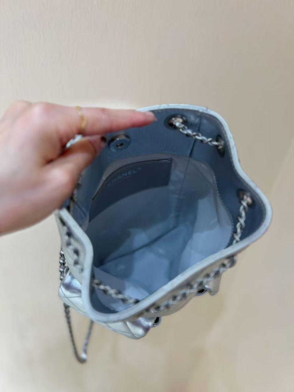 DRAWSTRING BUCKET BACKPACK 24 IN SILVER-TONE LAMBSKIN SILVER HARDWARE